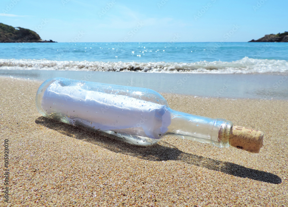 Message in a bottle, washed ashore the beach 