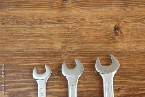 set of mechanical hand tools on wooden background