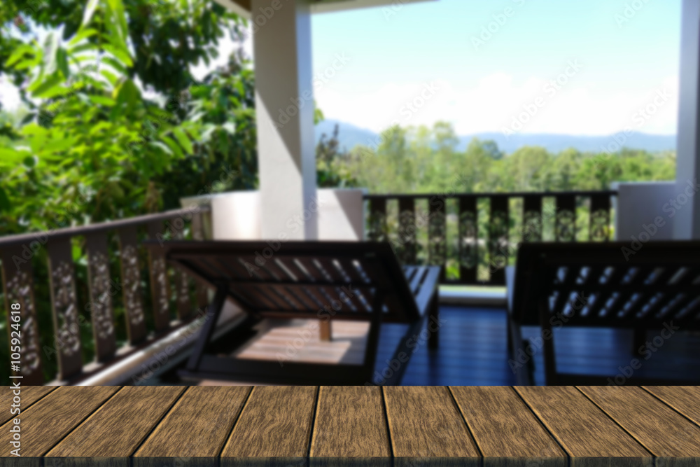 wooden deckchair at the balcony with forest and sky view