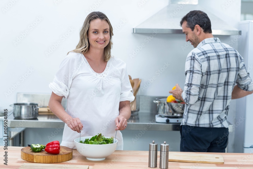 Pregnant couple in kitchen Pregnant couple in kitchen