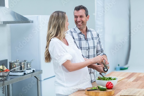 Pregnant couple in kitchen