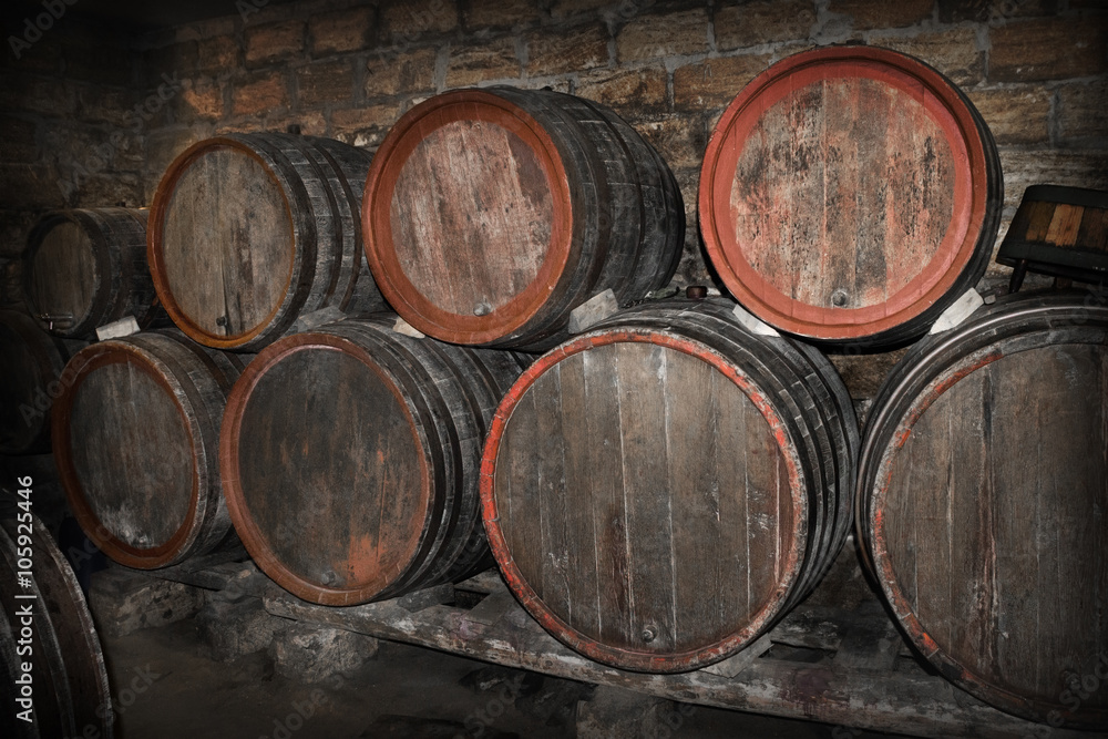 lying barrels of wine in a cellar