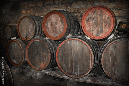 lying barrels of wine in a cellar © tillottama
