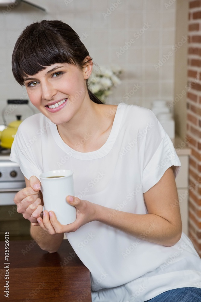 Young woman having a cup of coffee Young woman having a cup of coffee