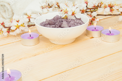 Beautiful spa composition with spring flowers on table close up