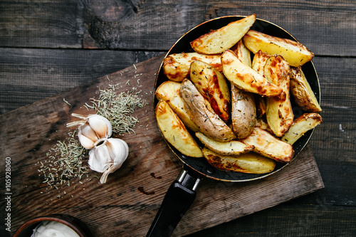 fried potatoes with garlic and rosemary