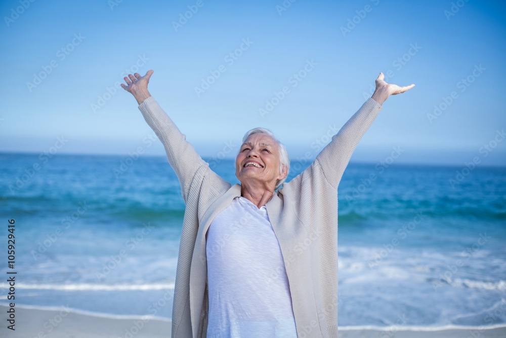 Fototapeta premium Beautiful mature woman outstretching arms 