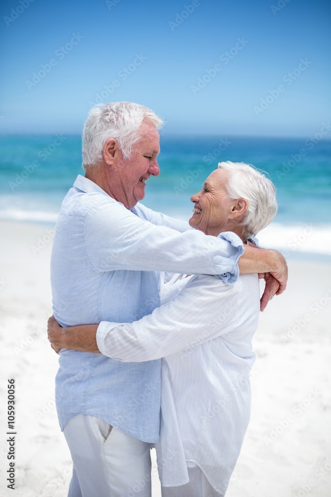 Senior couple embracing and looking at each other