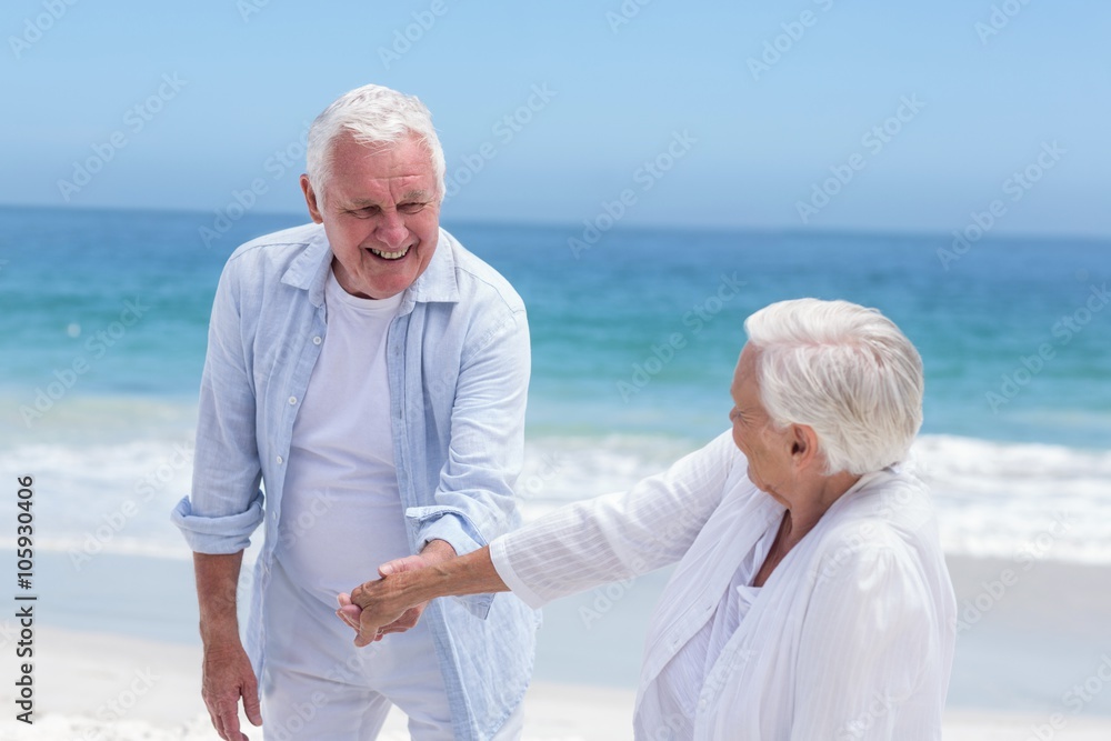 Senior couple playing at the beach Senior couple playing at the beach