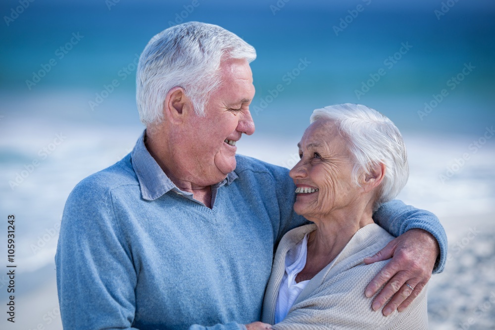 Senior couple embracing and looking at each other Senior couple embracing and looking at each other