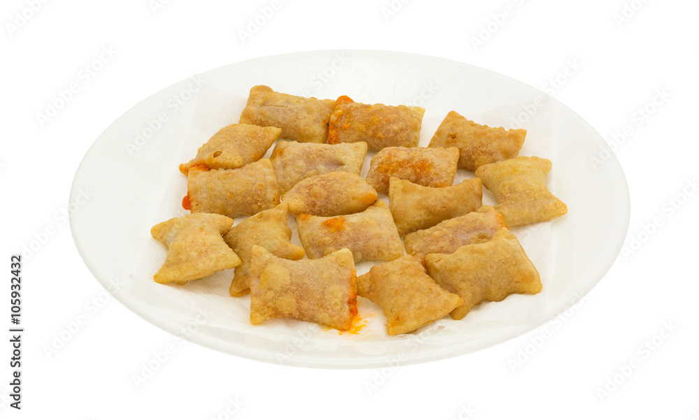 Bite size pepperoni pizza rolls on a white plate isolated on a white background.
Bite size pepperoni pizza rolls on a white plate isolated on a white background.