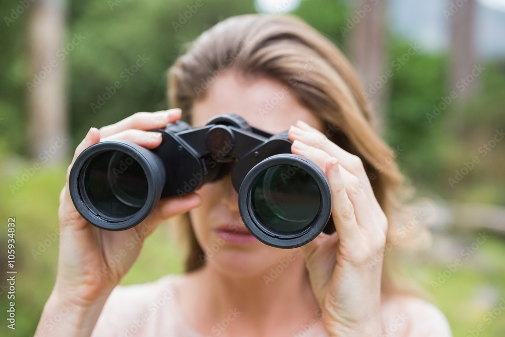 Woman using binoculars Woman using binoculars