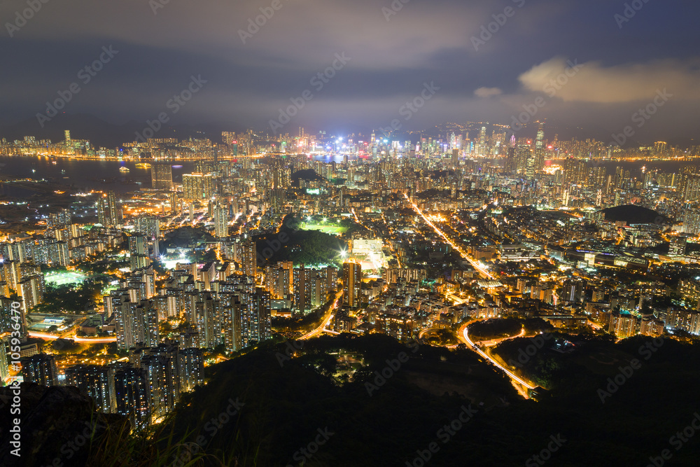 View of Kowloon in Hong Kong from above from the Lion Rock in Hong Kong, China, at night.
