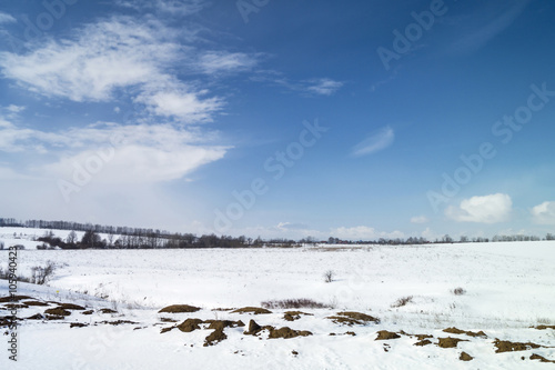 Winter landscape on background blue sky