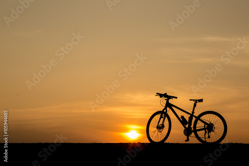 silhouette of  bicycle on sunset sky