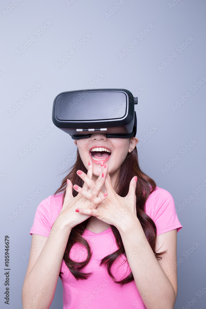 Happy woman watching virtual reality Happy woman watching virtual reality