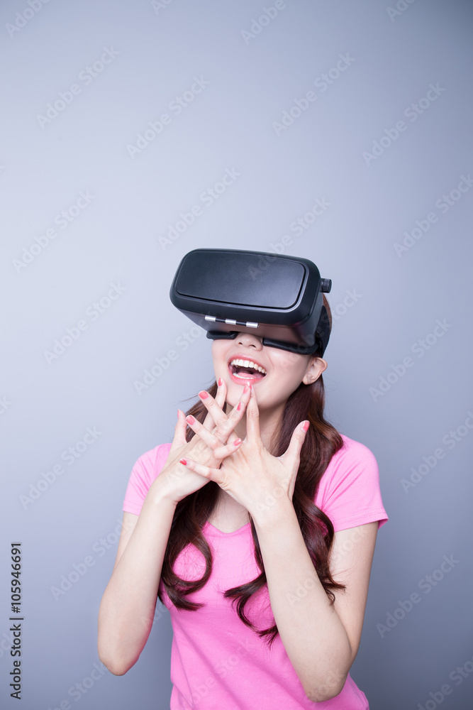 Happy woman watching virtual reality Happy woman watching virtual reality