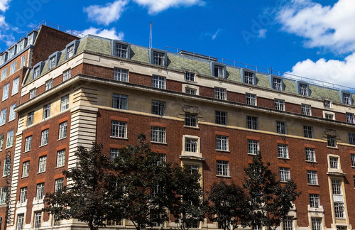  Typical English multistory red brick building in a summer afternoon at Coram street near Russell square