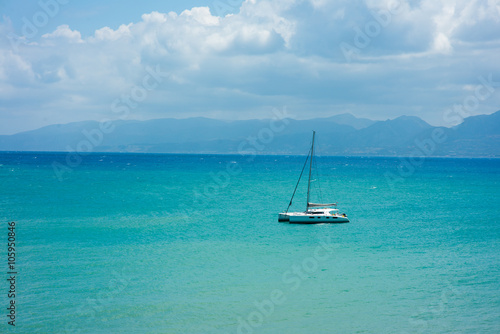 Fototapeta Naklejka Na Ścianę i Meble -  Boat in blue sea