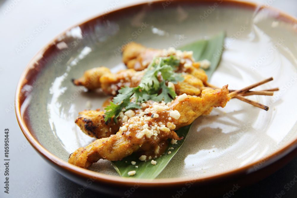 chicken satay, sate ayam and lontong with peanut sauce chicken satay, sate ayam and lontong with peanut sauce