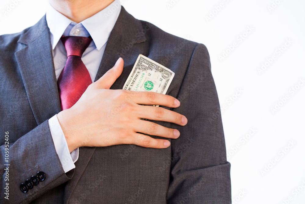 Business man hiding money in jacket pocket - Corruption and Fraud Concept Business man hiding money in jacket pocket - Corruption and Fraud Concept