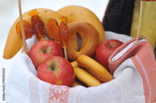 Basket with tradtitional russian bread, bagels, apples and sweetmeats  photo