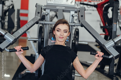 The girl at the gym on a simulator