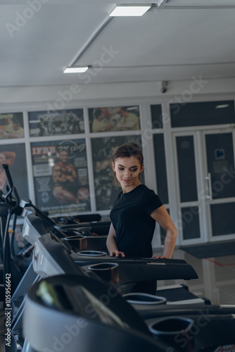 The sports girl on a treadmill