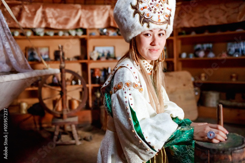 Young woman in traditional yurt dwelling.