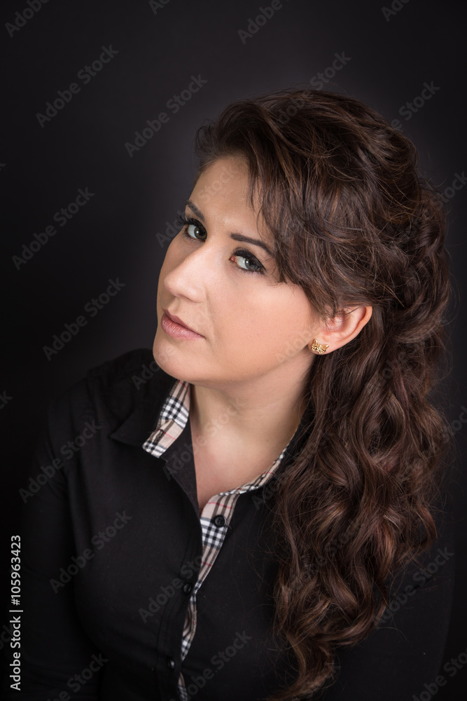 portrait of a young woman on a black background  - obrazy, fototapety, plakaty 