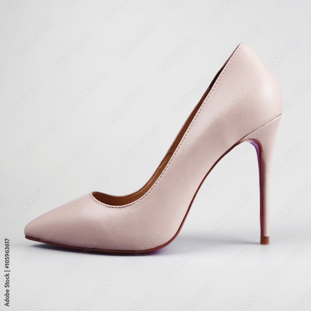 Pink high heel women shoes on white background Pink high heel women shoes on white background