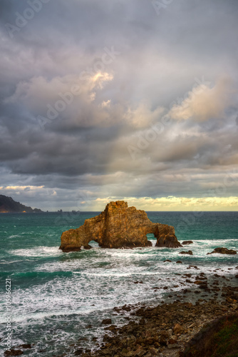 cloudy morning on the rocky coast of Pena Furada