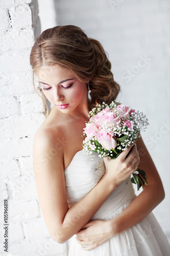 Beautiful woman with a wedding bouquet
