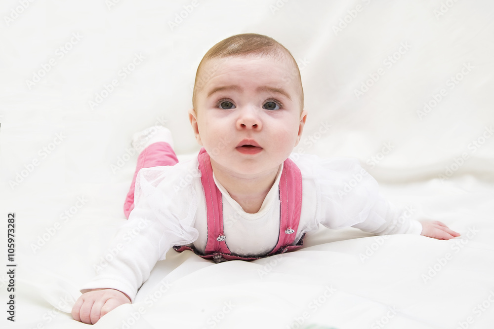 Adorable baby girl lying on white Adorable baby girl lying on white