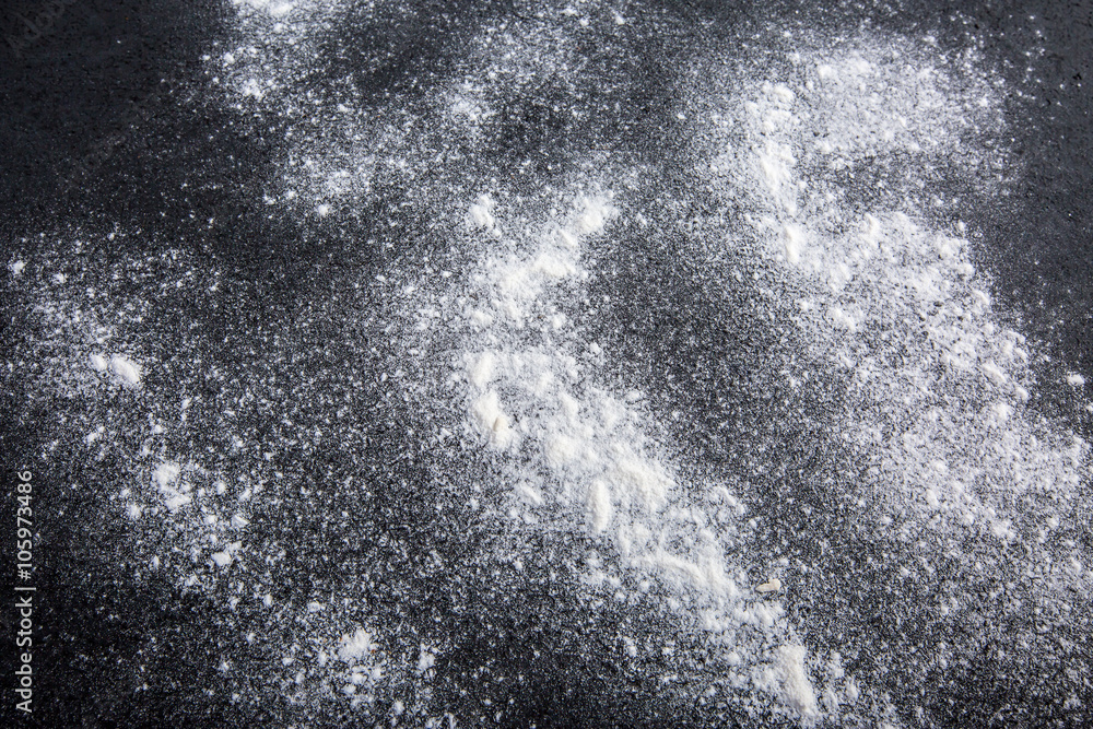 White flour on black background texture with copy space for easter - obrazy, fototapety, plakaty 