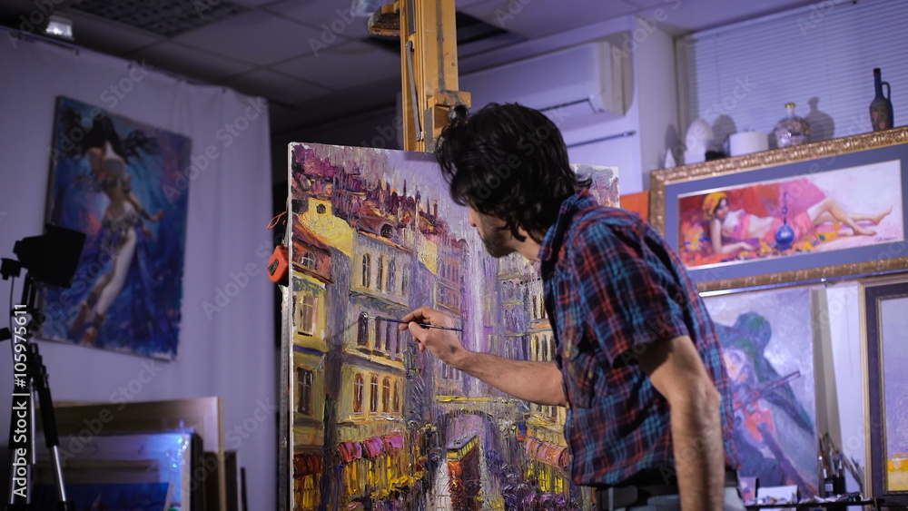 talented painter. In a cozy atmosphere. Artist painting picture in workshop talented painter. In a cozy atmosphere. Artist painting picture in workshop