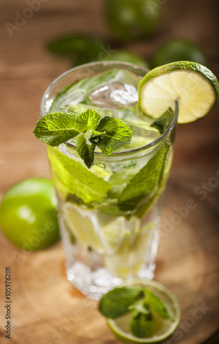 Mojito cocktail on wooden background