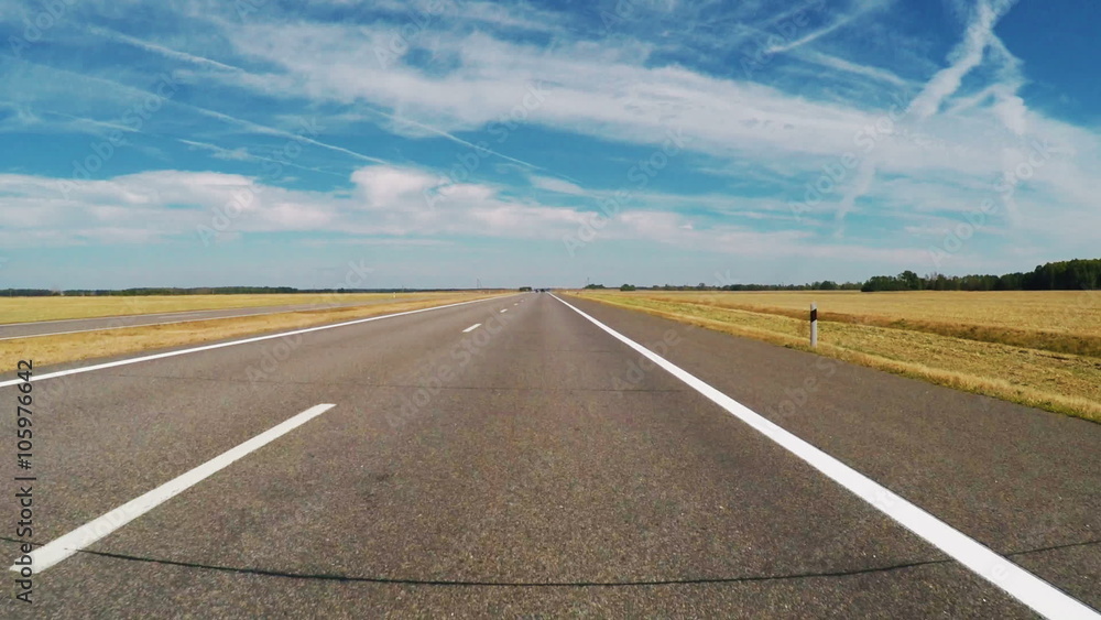 Car road travel on wide field landscape with blue sky
Car road travel on wide field landscape with blue sky