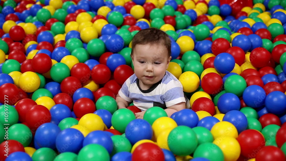 Baby play with balls in playground
Baby play with balls in playground
