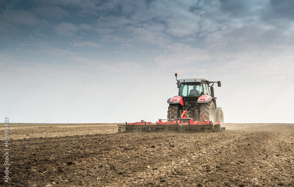 Tractor preparing land Tractor preparing land
