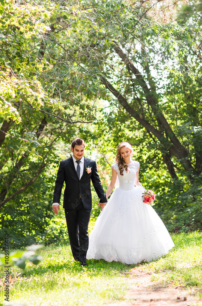 Romantic wedding couple having fun together outdoor in nature