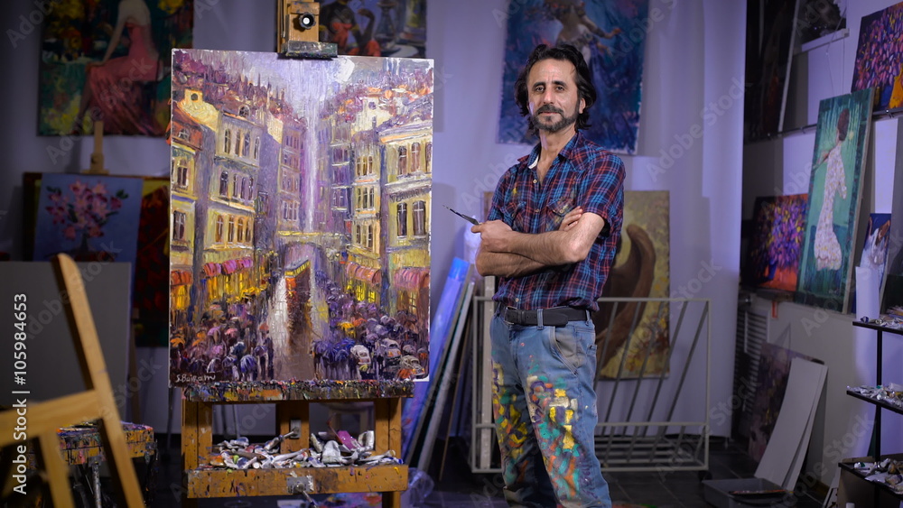 Success. Professional artist stands next to his new picture. Success. Professional artist stands next to his new picture.