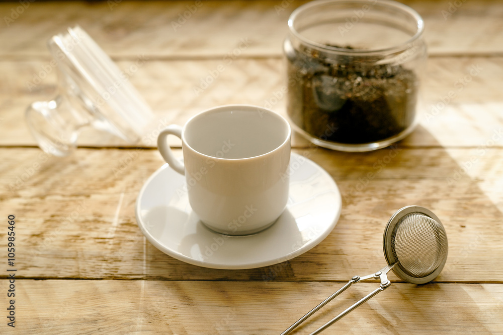 Tea set on the wooden table at sunny morning Tea set on the wooden table at sunny morning