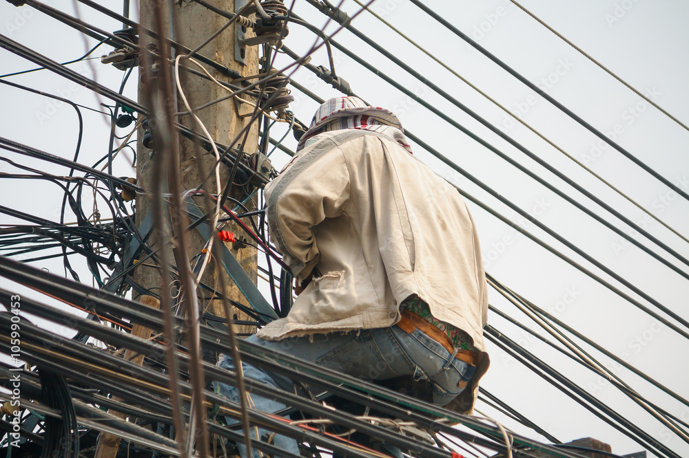 Electrician on electric poles Electrician on electric poles