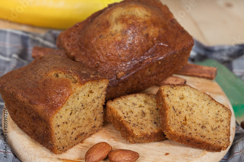 Homemade banana bread sliced on a table . rustic style