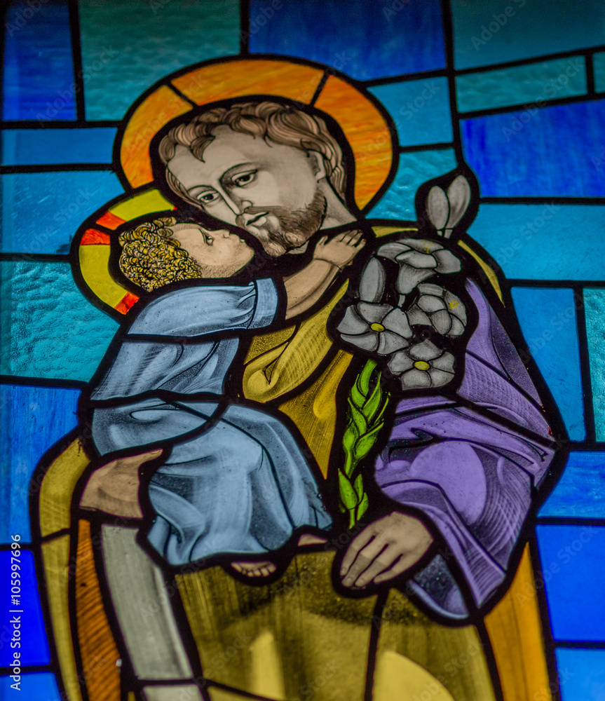 Baby Jesus kisses his father Joseph