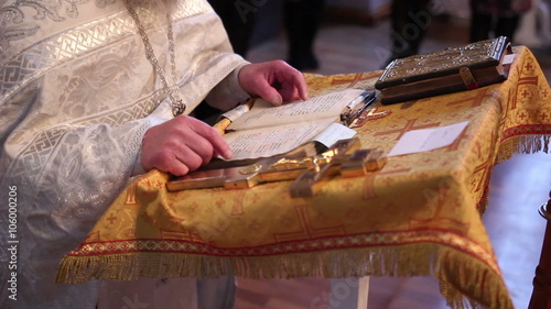 Orthodox priest reads Scripture
