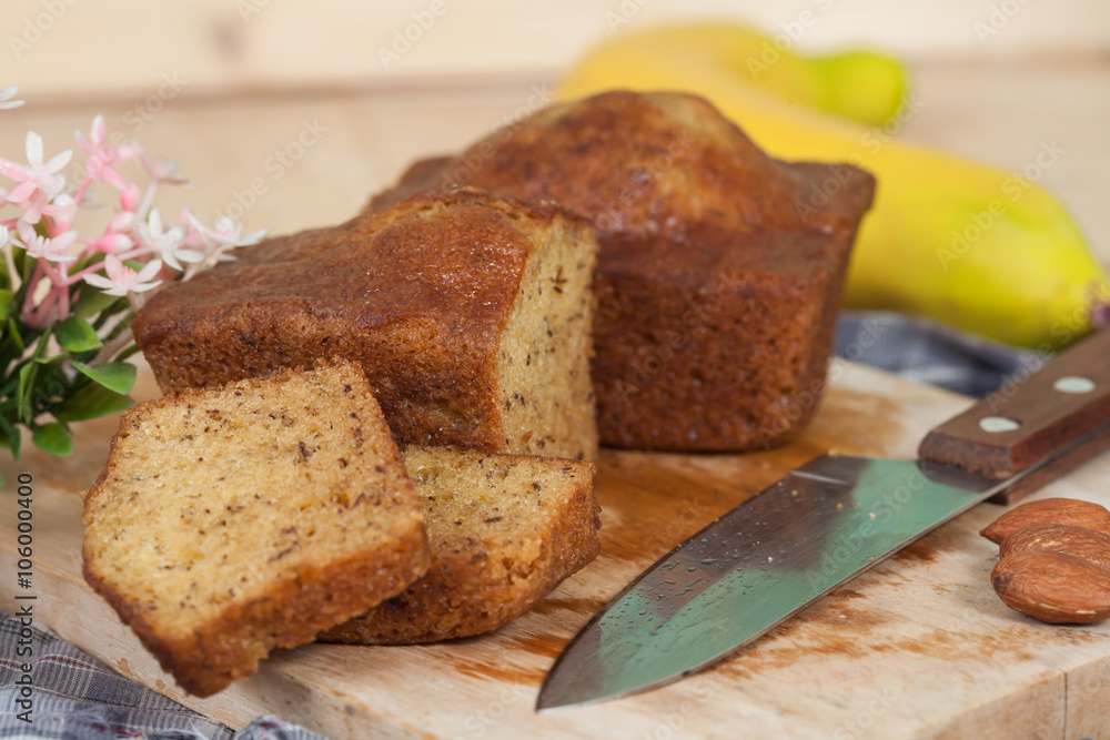 Homemade banana bread sliced on a table . rustic style Homemade banana bread sliced on a table . rustic style