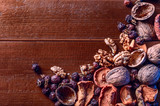 dried fruits, walnuts and dried berries rose hips as background