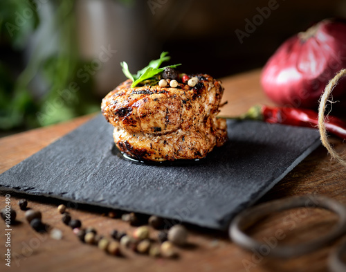 roasted fillet medallion on a wooden background photo